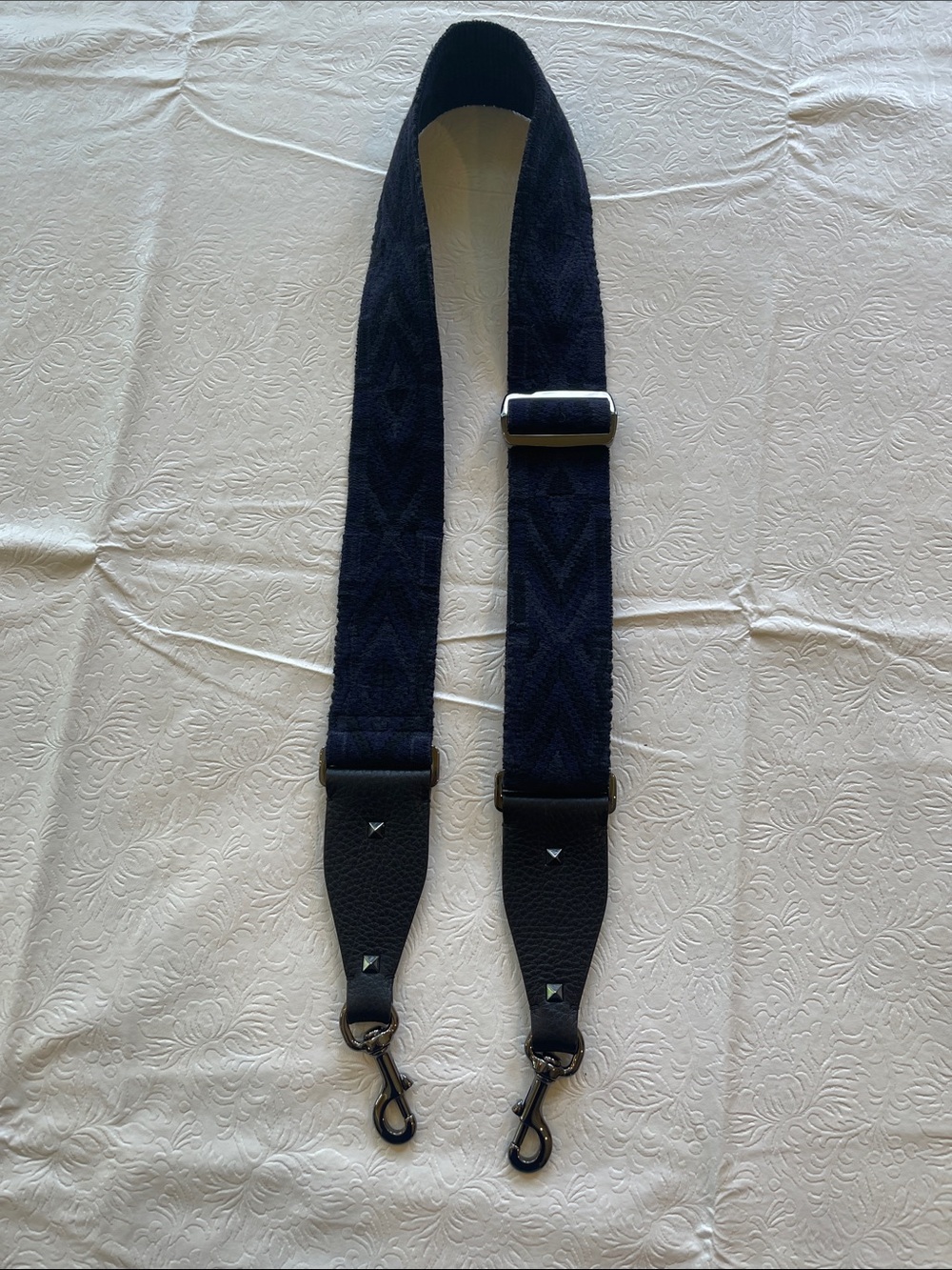 Valentino blue and black guitar bag strap. Gunmetal hardware. Good condition.